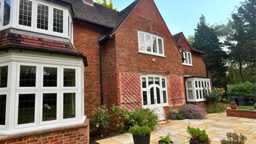 Large house in a conservation area of Purley. Timber windows with leaded design and french doors in white