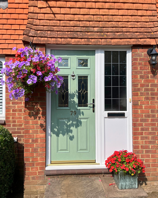 Green composite front door with side panel and chrome furniture