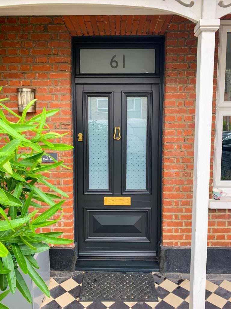 Black timber alternative front door with custom etched glass