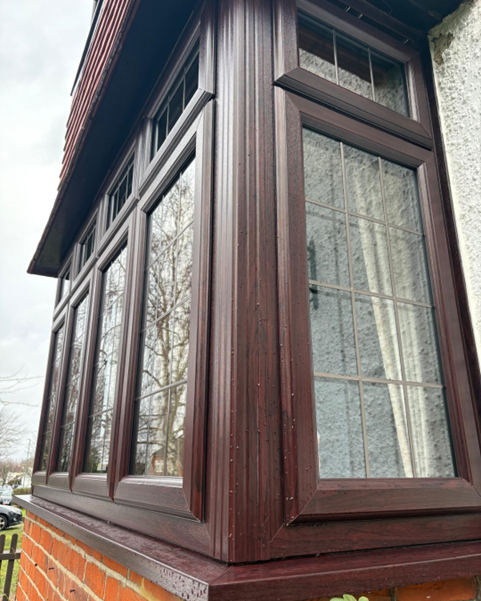 semi-detached house with PVC off white windows and french door porch