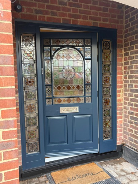 Blue custom stained glass with surround