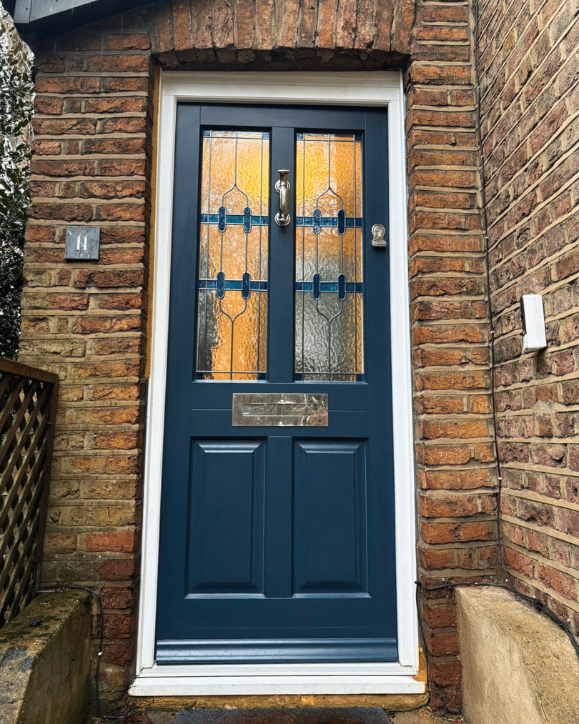 Farrow and Ball Hague Blue timber front door with Kathedral patterned stained glass