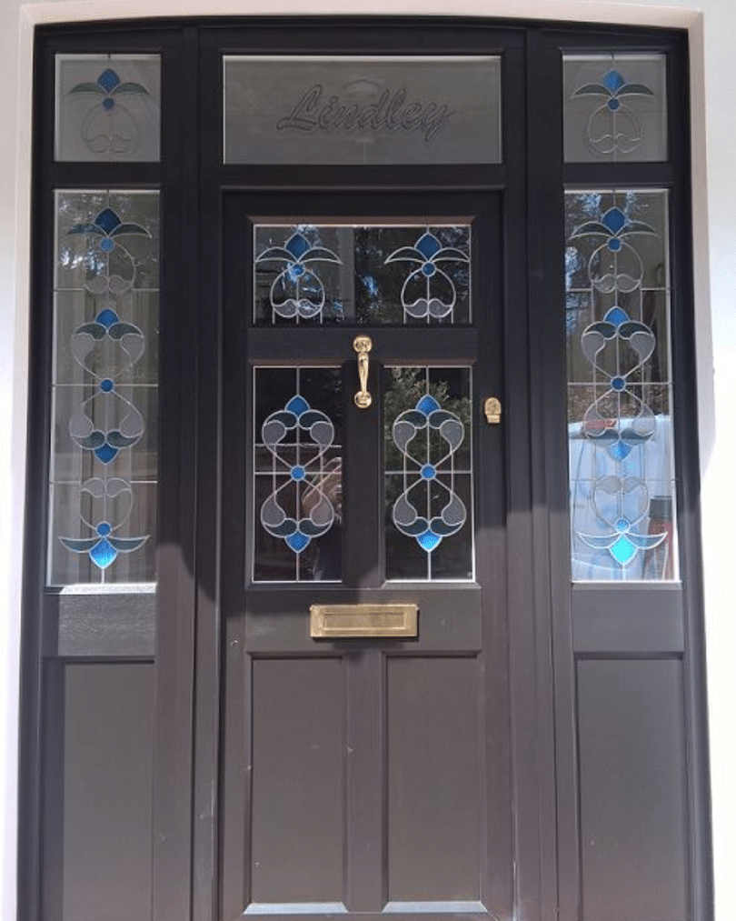 black front door with blue stained glass timber alternative