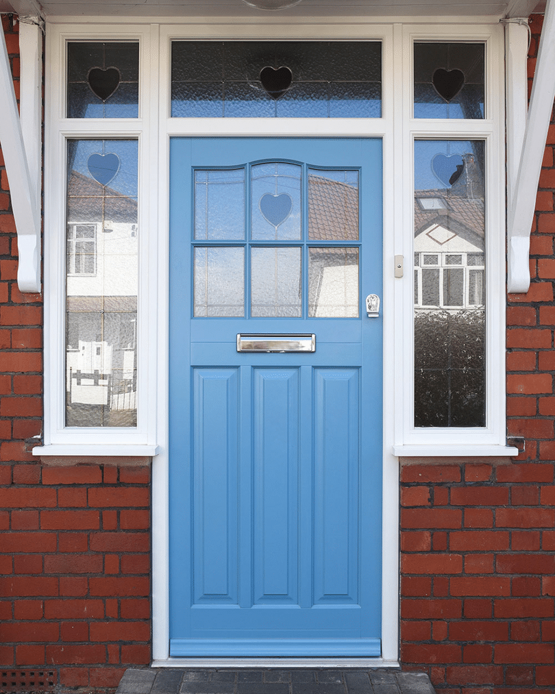 burgundy front door with arched windows and stained glass