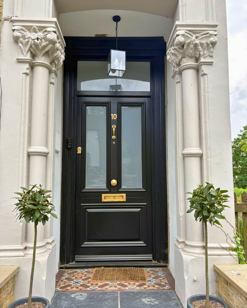 timber front door in black with a toplight