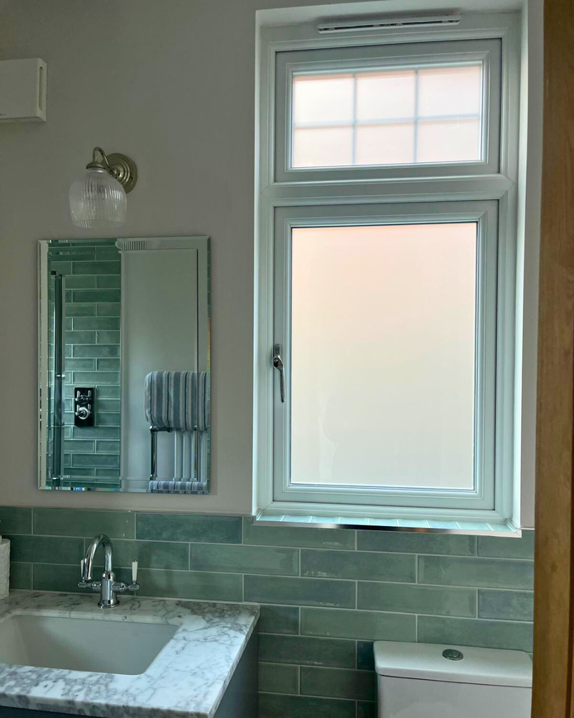 PVC grey window in bathroom