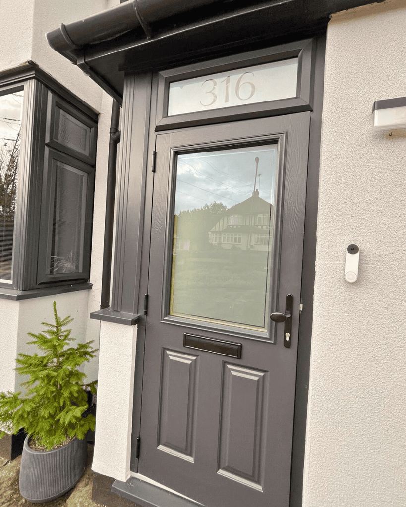 1930s British semi detached house anthracite grey front door grey windows porch modern traditional exterior